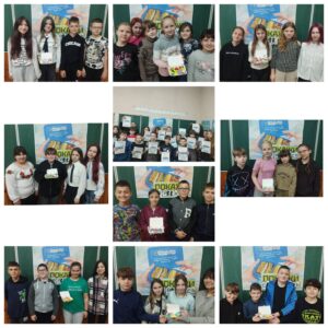 Учні з овочами та фруктами у ланчбоксах під час Тижня здорового харчування